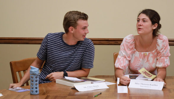 Two study at the classroom table