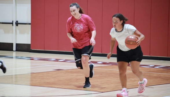 A White Team student has the ball