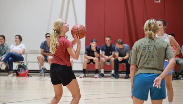 A student makes a shot on the net