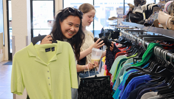 A student holds up a lemongrass polo