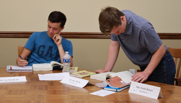 Two study at the table