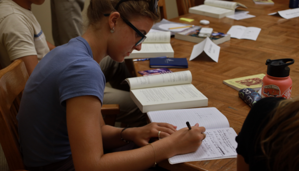 One studies at the table