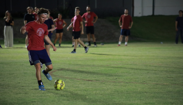 A student kicks the ball