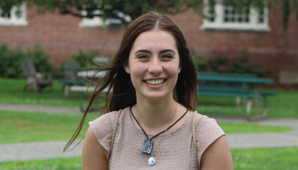 A student smiles for the camera