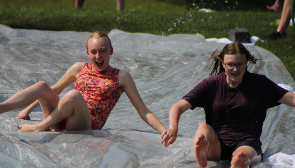 Two go down the water slide