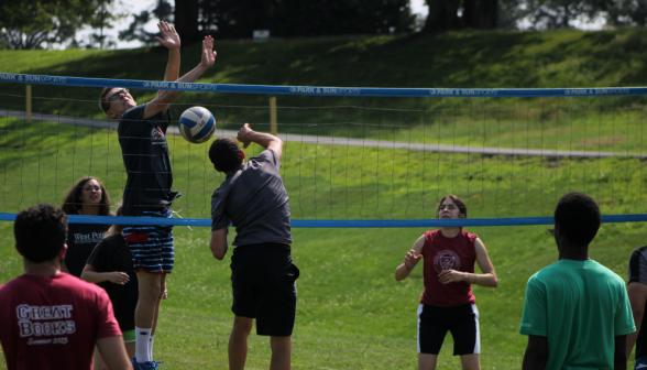 Students play volleyball