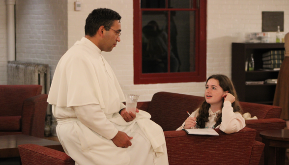 Fr. Miguel chats with a student