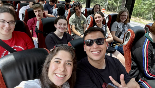 Students in the bus pose for the camera