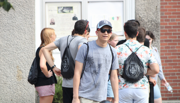 A group of students at one of the info boards