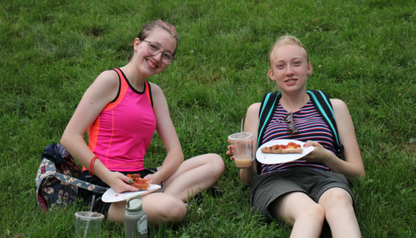 Two seated together pose for a photo