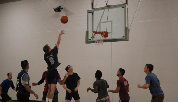 A student makes a shot on the net