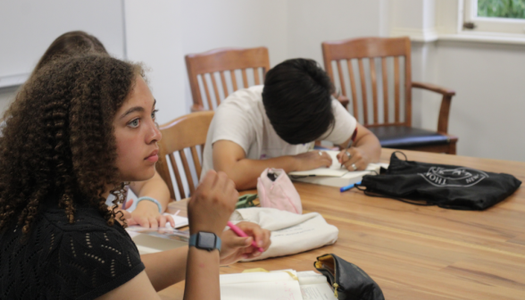 A student watches a demonstration