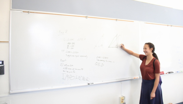 A student practices props at the board