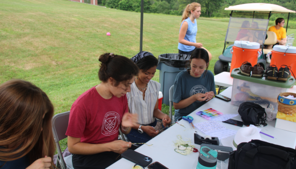 Students make handcrafts at another table