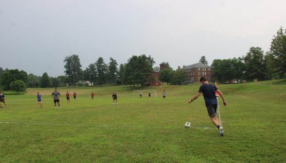 Students play soccer on the athletic field