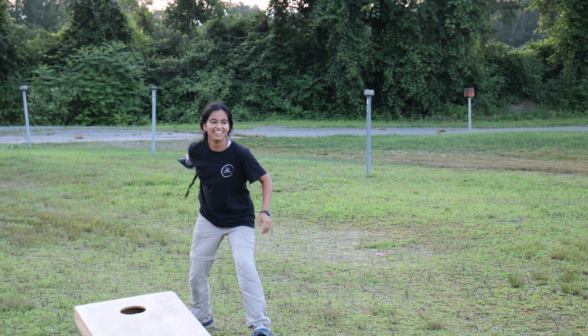 A student plays beanbags