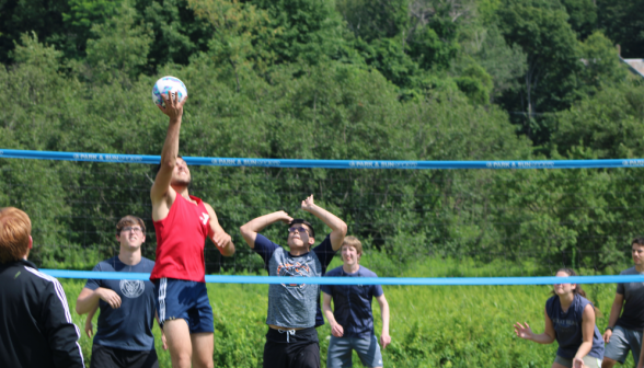 Students play volleyball