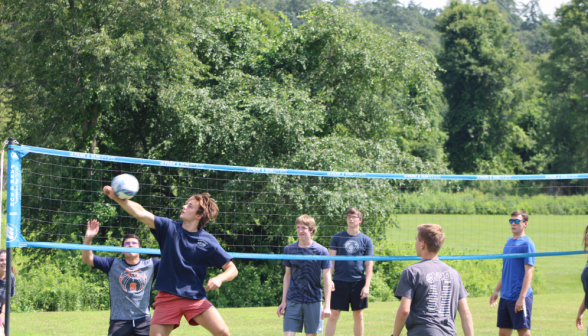 Students play volleyball