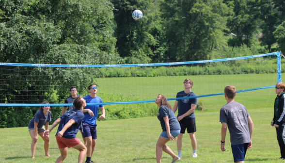 Students play volleyball