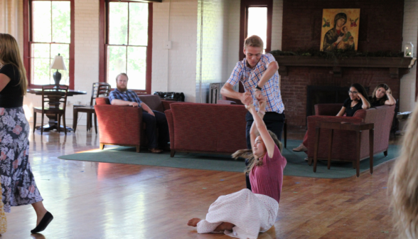 A student pair performs an advanced move