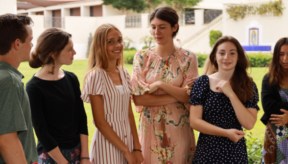 Students walk along the academic quadrangle