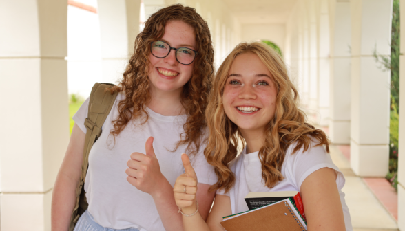 Students walk along the academic quadrangle