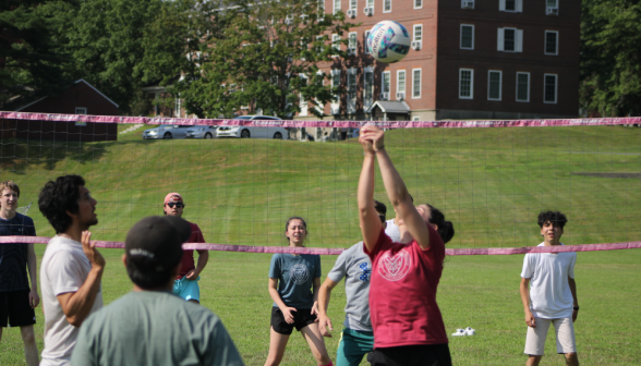 Students play volleyball