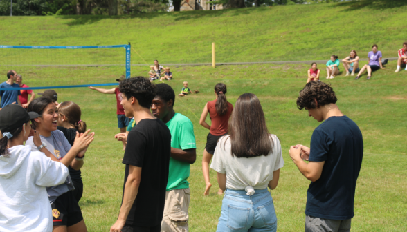 Students play volleyball