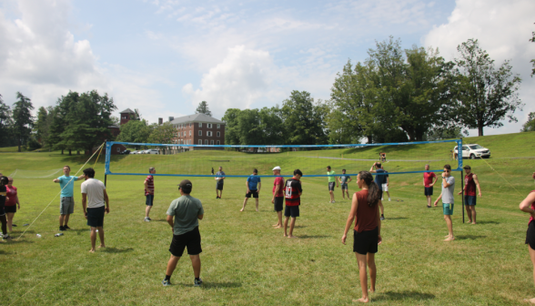 Students play volleyball