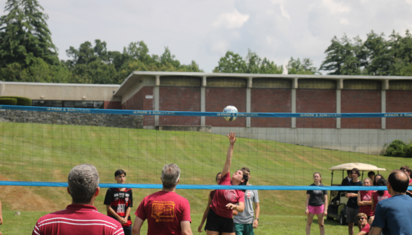 Students play volleyball