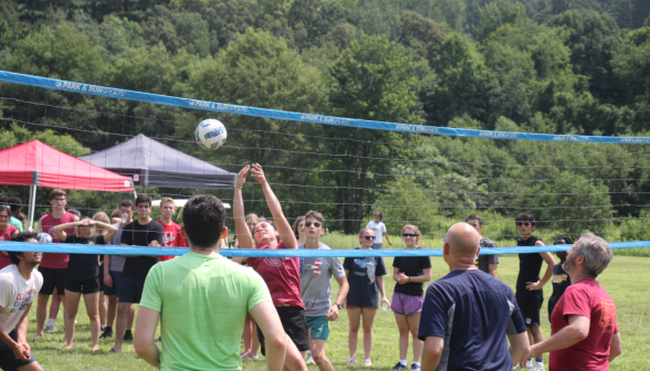 Students play volleyball