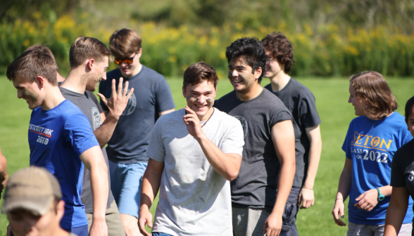 A group of smiling young men.