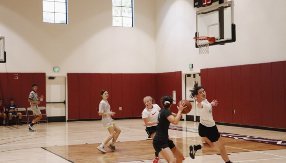 Students play basketball