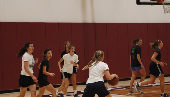 Students play basketball