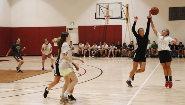 Students play basketball