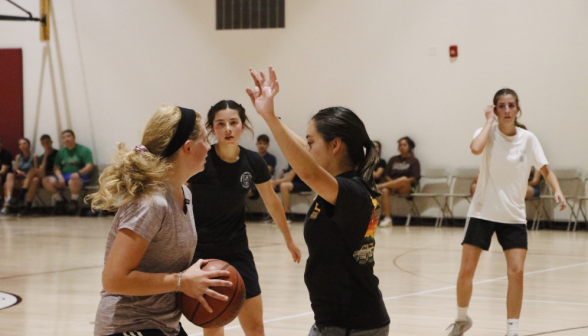 Students play basketball