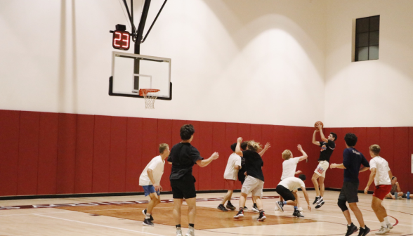 Students play basketball