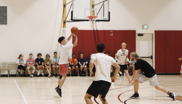 Students play basketball