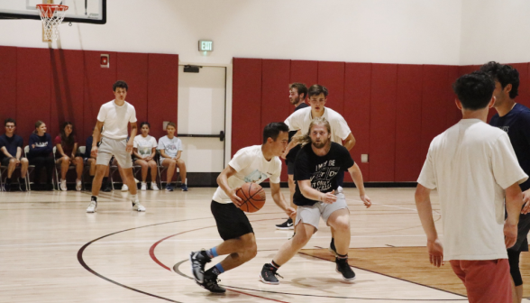 Students play basketball