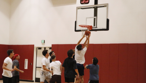 Students play basketball