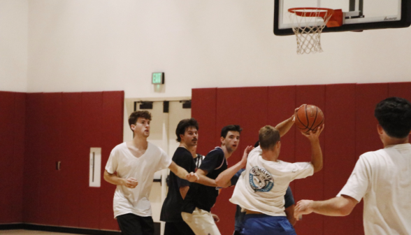 Students play basketball