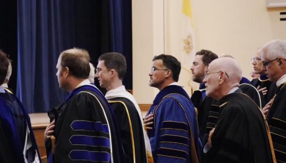 Tutors recite the Pledge of Allegiance