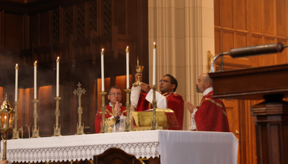 Fr. Miguel offers the Blood