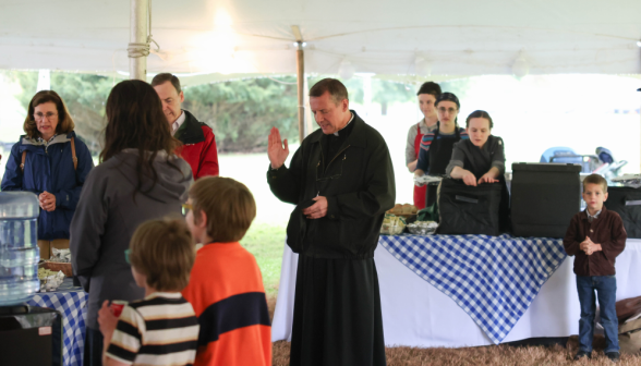 Fr. Markey blesses the food