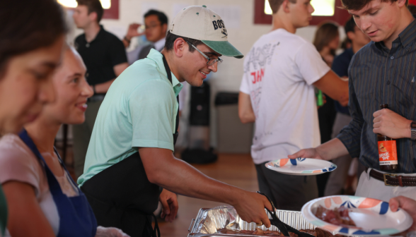 Admissions staff member pitches in