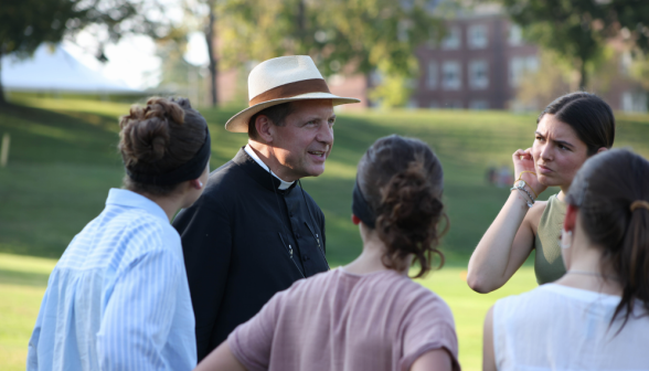 Fr. Markey talks with some of the girls