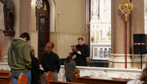 Fr. Markey leads the group in prayer