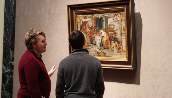 Greg Maynard ('26) discusses art with another pilgrim