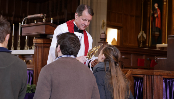 Blessing in New England with a relic of the True Cross