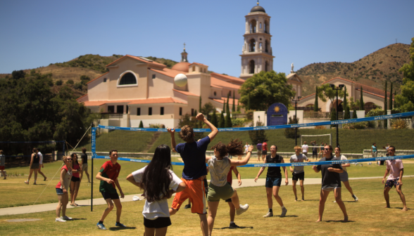 Students play volleyball